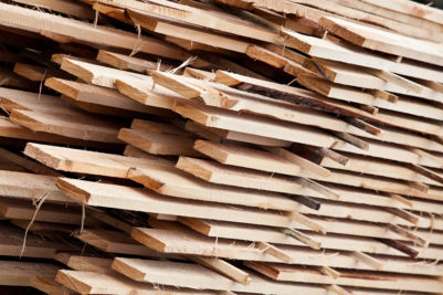 stacks of raw lumber ready to be milled